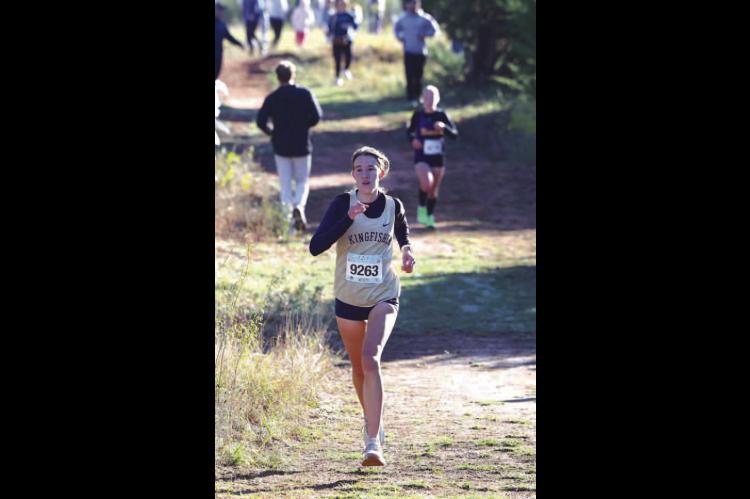 KHS SENIOR Addison Price prepares to run the final stretch of last Saturday’s 4A cross country regional. She passed two runners during that stretch and placed 41st to help KHS qualify for state. [KT&amp;FP Staff Photo]