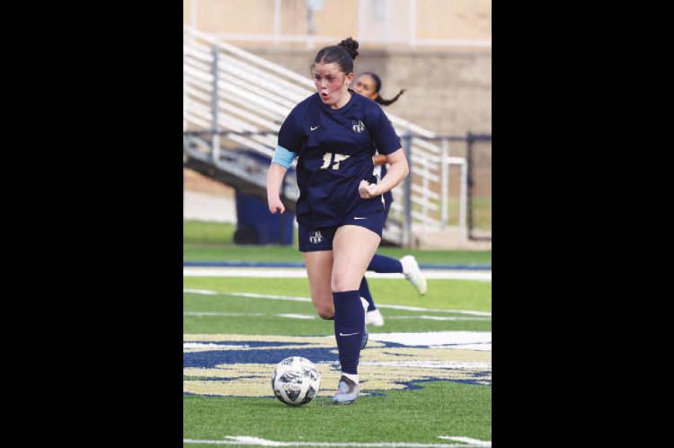 KHS JUNIOR Jennings Broddle pushes the ball down the field during Tuesday’s home loss to OKC Storm. Broddle scored Kingfisher’s lone goal in the game. [Photo by Russell Stitt/www.stitt.smugmug.com]