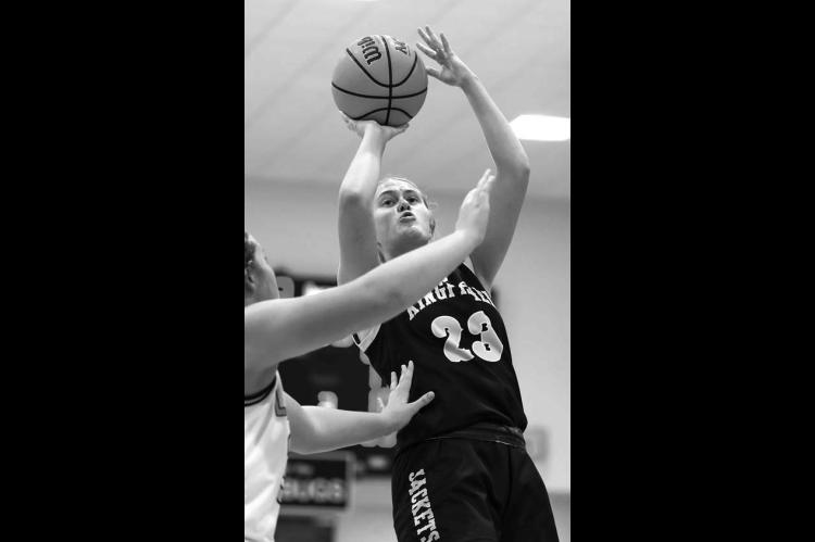 RAEGAN SNIDER attempts a shot against Alva in the semifi nals. The KHS senior earned all-tournament honors. [Photo by Russell Stitt/www.stitt.smugmug.com]