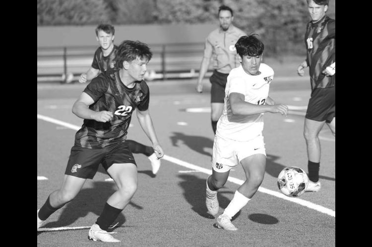 KHS SOPHOMORE Eduardo De La Torre (right) battles for possession during the first half of last Friday’s 8-3 loss at Crossings Christian. De La Torre scored one of Kingfisher’s goals in the loss. [KT&amp;FP Staff Photo]