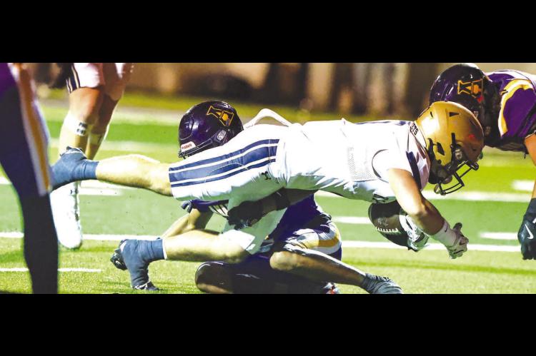 DESPITE SUFFERING a separated shoulder in the first half, sophomore Brett Calamateo returned to the game and played through the pain, which included fighting through tackles and diving for the end zone on this play. His TD reception gave KHS a brief 14-7 