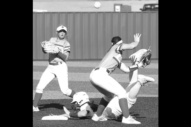 HEELS OVER HEAD – Kendall Farrar slides safely into second base during Thursday’s 4-2 win over Chisholm. [KT&amp;FP Staff Photo]