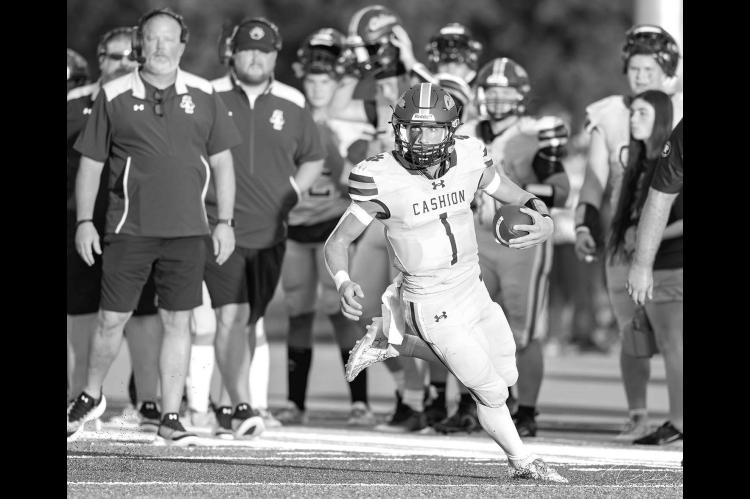 CASHION QUARTERBACK Kellen Smith, pictured in the team’s season opener against Hennessey, had a big night Thursday against rival Crescent. He accounted for four touchdowns and 331 yards of offense as the Wildcats won the War on 74 for the second straigh