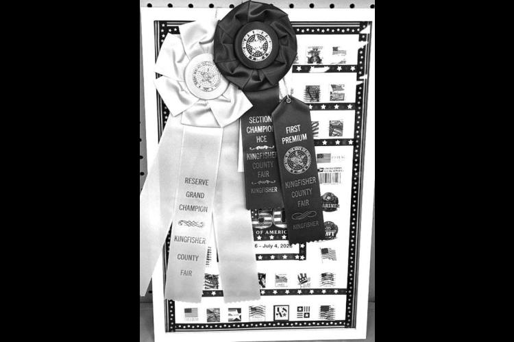 HENNESSEY FARMERETTES’ Mary Curry made this collection of flag stamps from stamps she had collected for many years. It also had items to honor the Marines, Army, Navy, Air Force and Coast Guard since members of her family have served in all of those branches. Her entry at the Kingfisher County Fair won a number of top honors. [Photo provided] Akenhead showed the reserve champion ribbon