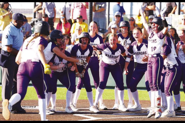 OKARCHE SOFTBALL team members await at home plate for the arrival of Kinley Pruett after she hit a three-run home run in the fifth inning Thursday in the quarterfinal round of the Class A state softball tournament. Pruett’s homer turned a 4-3 deficit into a two-run lead, one the Lady Warriors wouldn’t lose as they knocked off second-ranked Caddo 10-4 to advance to the semifinals. See inside for more. [KT&amp;FP Staff Photo]