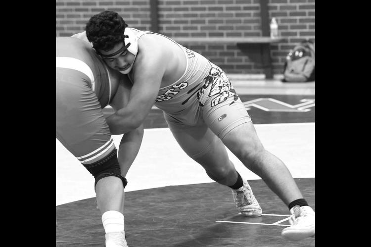 KINGFISHER’S Josey Santoyo competes at a dual earlier this season against Hinton. The Jacket senior won gold at heavyweight during the Kingfisher tournament last weekend, the first championship of his career. [Photo by KHS Photography]