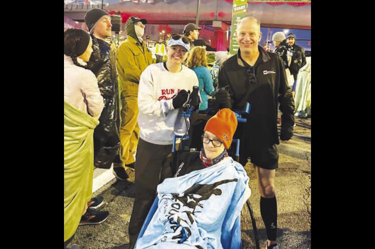 DARK AND EARLY – Bethany Piotrowski, left, is pictured with Hunter and Jeff Wittrock prior to the start of the Publix Atlanta Half-Marathon held earlier this month in Georgia. The trio was at the starting line by 5 a.m. for a race that started more than