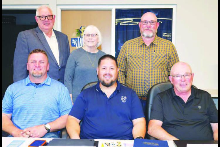KINGFISHER SUPERINTENDENT Andy Evans (top left) joined the Kingfisher Board of Education for a photo at Monday’s meeting. Standing with him are members Dana Golbek and Charles Walker. Seated are, from left: Vice President Brad Wittrock, new member and Clerk Alberto Sanchez and President Bill Reitz. [Photo by KHS Photography/www.khsphotography.smugmug.com]