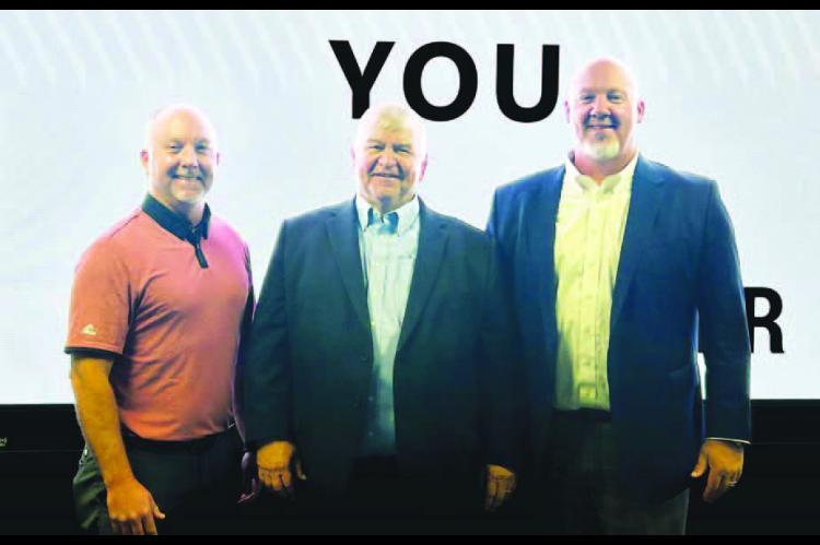 BUSINESS LUNCH – Kingfisher City Manager Jim Thomas (center) and Mayor Geoff Covalt (right) are joined by Pioneer General Manager Blake Callaham after the two city dignitaries spoke at a luncheon held in Pioneer’s Engineering Conference Center last We