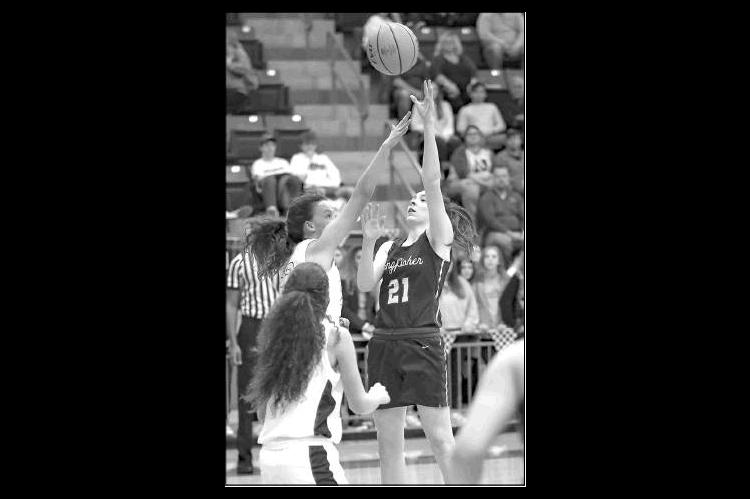 KINGFISHER’S Allison Green (21) puts up a shot against Newcastle. Green paced Kingfisher with nine points.             [Photo by Chris                           Simon/www.simon-sports-photos.smugmug.com                                      ]