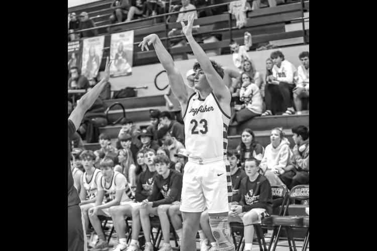 JACKSON WILLBANKS scored 12 points Monday as Kingfisher defeated Pond Creek-Hunter for the consolation championship at the Wheat Capital Tournament. [Photo by Chris Simon/www.simon-sports-photos.smugmug.com]