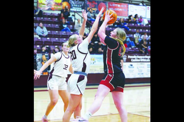CASHION SENIOR Jaylee Harp (20) blocks a shot attempt by a Watonga player during the first half of the Lady Wildcats’ eventual four-point win in their Class 2A district championship game. [KT&amp;FP Staff Photo]