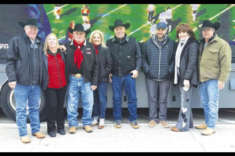 HENNESSEY’S JACK TONEY was honored during last weekend’s OSU football game in Stillwater. Among those there to celebrate the honor were, from left: Enid friends Kenny Dennett and Gwen Overton; honoree Jack Toney of Hennessey; Hennessey friends Jamie a