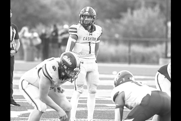 CASHION QB Kellen Smith, picutred in the team’s season opener against Hennessey, accounted for more than 300 yards of offense last Friday, but the Wildcats were ousted from the playoffs in a 24-14 loss at Minco. [Photo by Rylee Broadbent]
