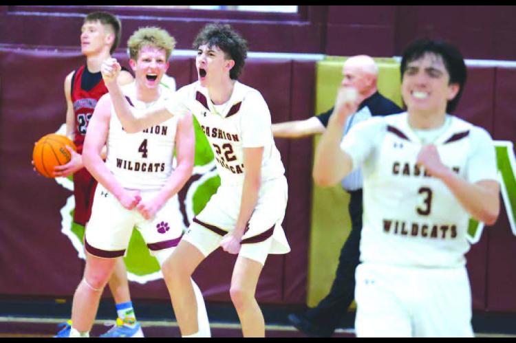 CASHION PLAYERS Brayden Stuemky (4), Grayson Little (22) and Parker Mitchell (3) react after Little made a bucket while being fouled to help seal their team’s win over Watonga on Thursday night. [KT&amp;FP Staff Photo]