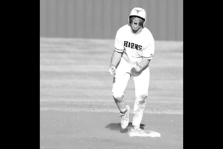 DOVER CATCHER Sloan Merrill reacts after hitting a run-producing double Friday against Vici in the Longhorns’ first game of their own festival. Dover went 3-0 over the two days of the event. [KT&amp;FP Staff Photo]