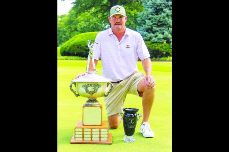KINGFISHER’S Heath Myers poses with the trophy that will have his name etched on it a third time after winning the OGA Mid-Amateur Championship last week. [Photo by Connor Koenig/Golf Oklahoma]
