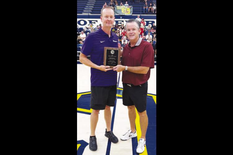 Okarche boys basketball coach was honored last weekend during the Oklahoma Basketball Coaches Association’s annual all-star weekend. West, left, was presented the OBCA’s 2026 Willis Mackey Award for Small-School Coach of the Year. He’s being presented the honor by Kenny Bare of Velma-Alma, the current OBCA president. West guided Okarche to a 29-3 record and its third consecutive Class A state championship during the 2025-26 season. 
