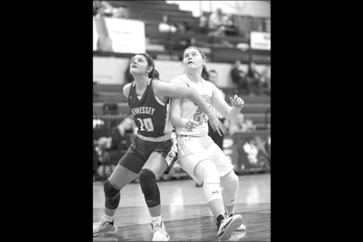 HENNESSEY’S Meagan Tillman (10) and Cashion’s Issy Reeves (24) battle for position in the lane during their teams’ quarterfinal game on Thursday.             [Photo by Russell                           Stitt/www.stitt.smugmug              