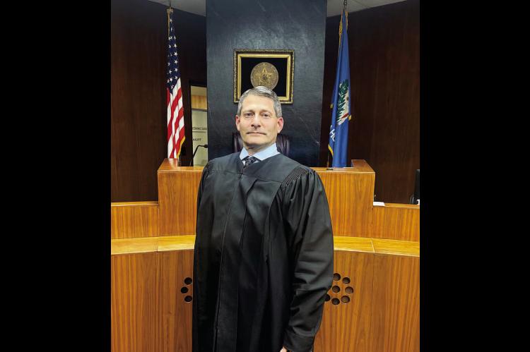 KINGFISHER COUNTY Associate District Judge Lance Schneiter stands in front of the in the courtroom he’s overseen since taking office in 2019. Schneiter was one of 14 people to apply for the District 4 seat of the Oklahoma Supreme Court. [KT&amp;FP Staff
