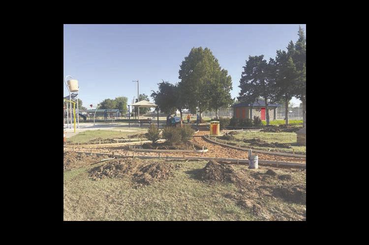 MMS Construction & Paving, owned and operated by Shawn Scammahorn of Kingfi sher, was busy pouring concrete for two projects this week. In the photo above, concrete was poured for walkways at Shaw Park on Oklahoma Avenue for the City of Kingfi sher. The upgrade also featured new changing and restroom facilities for the Kingfi sher Splash Pad located at the park. Bob Bollenbach of Bollenbach Construction of Kingfi sher managed that construction project.
