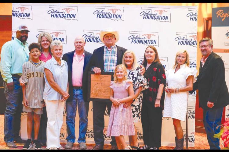 YEOMAN HONORED – Dover’s Byron Yeoman (holding plaque) was named the 2025 Oklahoma Cattleman’s Association Cattleman of the Year recently. He was joined at the award presentation by several family members, including, from left: Tyrone Bell, Kyson Cl