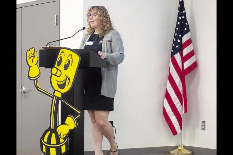 BUSINESS ADVISOR Emily Beesley talks to several dozen Kingfisher Chamber of Commerce members during a luncheon on Wednesday. Beesley works for the Oklahoma Small Business Development Centers. [KT&amp;FP Staff Photo]