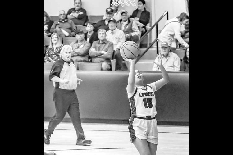 JACKIE PENARAN shoots an uncontested layup during Lomega’s win over Taloga. She scored 17 points in the contest. [Photo by Chris Simon/www.simon-sports-photos.smugmug. com]