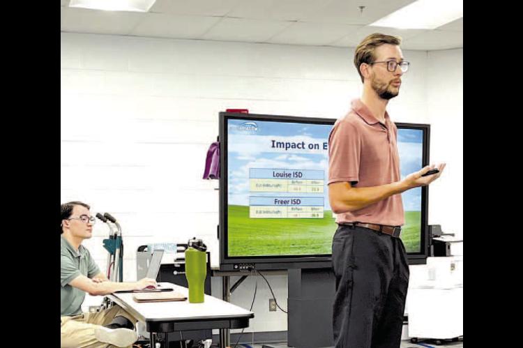 IDEAL IMPACT’S Noah Hines fi rst made a presentation to the Hennessey Board of Education during its May meeting about the company’s ability to save the district money on its utilities bill. The board voted Monday to enter into a contract with the Texas-based company. [KT&FP Staff Photo by Barb Walter]