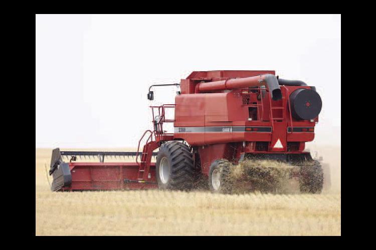 KENNETH KARRENBROCK cuts wheat east of Kingfisher at the beginnig of the harvest season. Others in the county were able to resume after rains late last week, but more rain is in the forecast for this week. [KT&amp;FP Staff Photo]