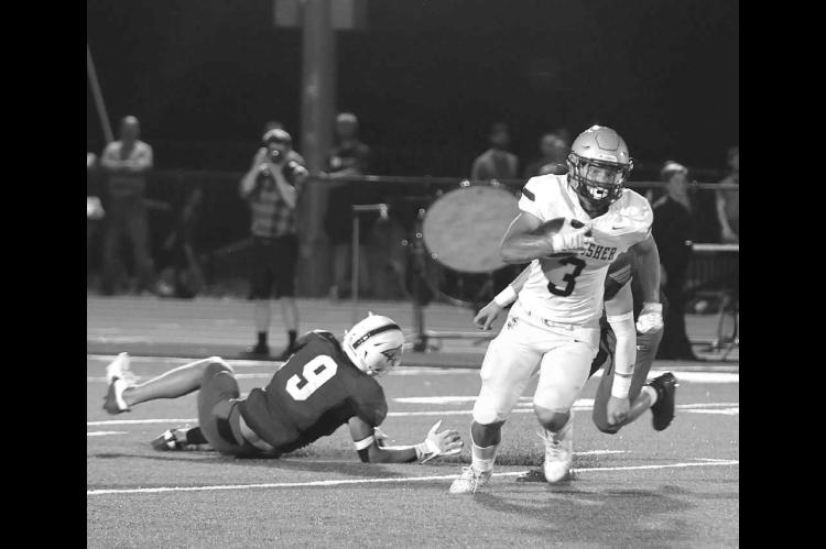 KASEN BLAIR is pictured breaking a tackle and taking off for the end zone. Blair had 156 yards and two touchdowns receiving in his team’s 35-6 win at Bridge Creek. [Photo by Hayden Green/KHS Photography]