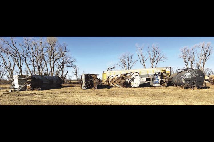 OFF TRACK - More than a dozen train cars derailed Monday night on the Union Pacific Railroad north of Dover. There was damage to some nearby land, but no injuries or chemical spills were reported by authorities. [Photos by Kingfisher County Emergency Mana