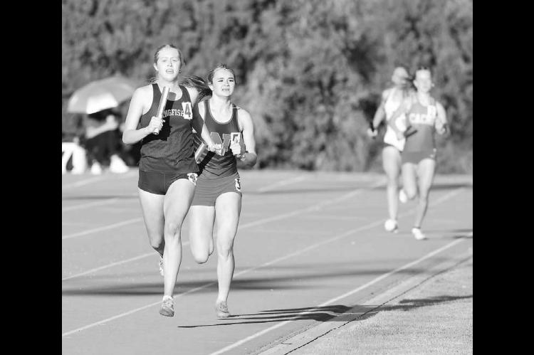KHS SENIOR Abbie Myers started her leg of the mile relay in second place, but by the time she headed down the backstretch, she had KHS in first. The KHS team went on to win the event and finish second overall at the 4A regional in Chisholm. [KT&amp;FP Staff Photo]