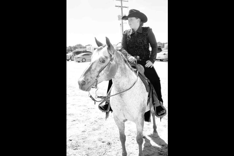 KIASER AND BLING – Kiaser Stout with her horse Bling while competing at the West District North Region Horse Show, where she earned the Senior Overall High Point title. [Photo provided]