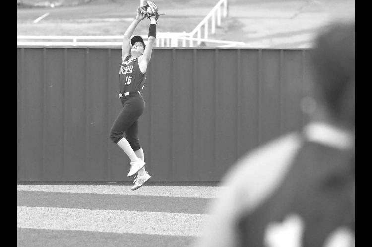 KHS SOPHOMORE Callie Blair makes a leaping catch in right field to rob an extra-base hit during the Lady Jackets’ home win over McGuinness on Monday. [KT&amp;FP Staff Photo]
