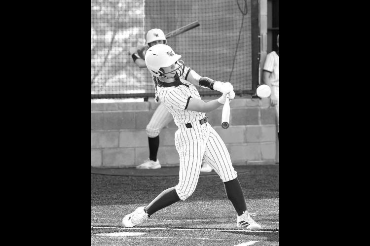 KENDALL FARRAR (above) is pictured just after connecting with a home run to center fi eld in the fi rst inning of Kingfi sher’s 8-2 win against Bethany. Lily Voth (left) got her fi rst pitching win of the season. [Photos by Russell Stitt/www.stitt. smugmug.com]