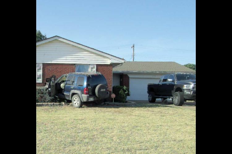 Fleeing car crashes into home