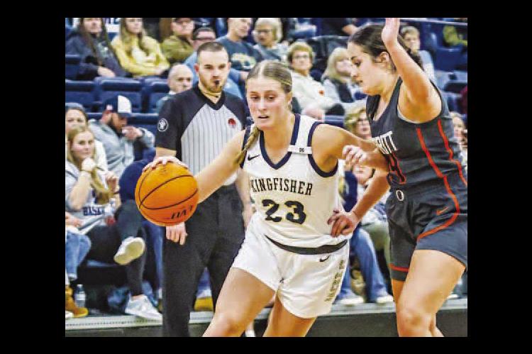 AS OF Tuesday, all six county schools are officially in basketball season. That includes Raegan Snider (23) and the Kingfisher Lady Jackets. For more on this week’s games, see Page 7. [Photo by Chris Simon/www.simon-sports-photos.smugmug.com]