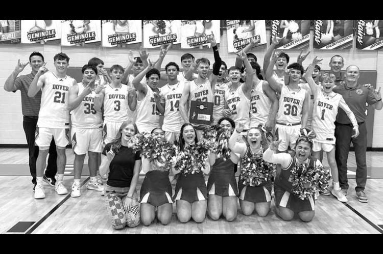 DOVER BOYS BASKETBALL players, coaches and cheerleaders celebrate after winnng a Class B area championship last Friday. [Photo provided]