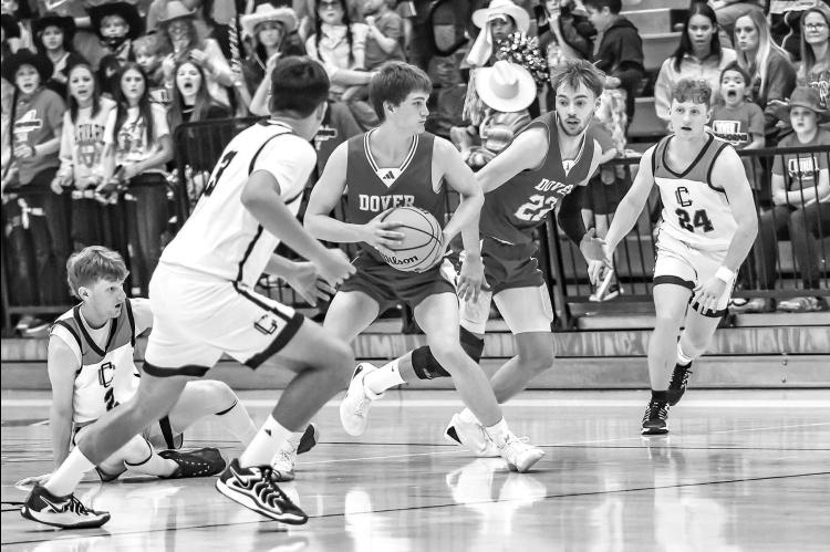 DOVER SENIORS Nathan Cohee (with ball) and Lucas Conrady get ready to break for the basket after creating a turnover against Calumet in the Class B boys state semifinals. It was just the second semifinal appearance for the program. [Photo by Chris Simon/w