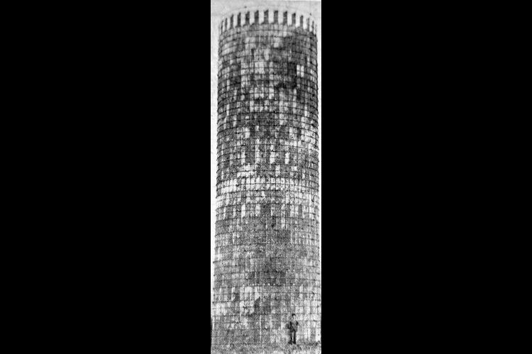 Pictured here is the newly-completed silo on the M. Neumann farm, southeast of Kingfisher. It is 18x60 feet and built of concrete plates. The company which sold it said it is the largest they have built in Oklahoma. The building was constructed by two men from the company in Kansas, and seven local men, in 36 hours. It took 55 sacks of plaster to smooth the inside. The silo will be used for ensilage. (Times, Aug. 2, 1951)
