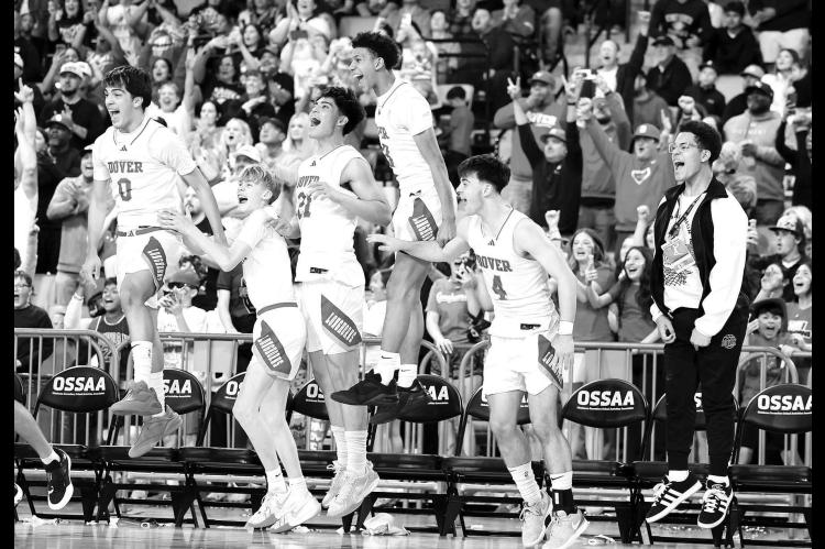 DOVER PLAYERS begin to celebrate toward the end of the Class B-II state championship game. The Longhorns downed Duke in convincing fashion to win their first-ever basketball title. Along the way, Daxx Compton, bottom left, and Kyler Williams, bottom right, were just two of the Longhorns who came up with big plays to help deliver the title. [Photos by Russell Stitt/www.stitt.smugmug.com]