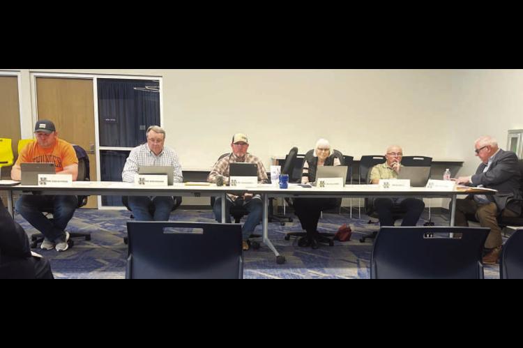 MONEY TALKS – Kingfisher Superintendent Andy Evans, far right, goes over the current budget situation with members of the board of education during Monday’s meeting. Board members are, from left, Brad Wittrock, Mike Copeland, Charles Walker, Dana Golb