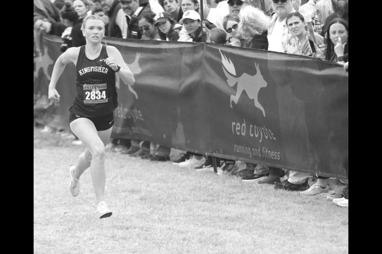 KHS JUNIOR Scout Snodgrass eyes the fi nish line of the Class 4A girls state cross country meet last Saturday. Snodgrass placed ninth individually, which earned her All- State status. The KHS girls placed sixth as a team, but were also recognized during the awards ceremony as the academic state champions. Team members accepting the honor were, from left: front row, Snodgrass, Mattie Slezickey, Terry Ann McCully, Lily Lunsford and Gisselle Ponce; middle row, Chloe Richardson, Rylee Long-Bush and Harper Evans