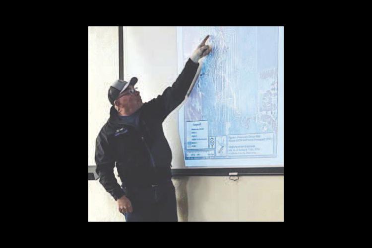 Bill Reitz is pictured going over plans to extend the runway at Kingfisher Municipal Airport. Reitz represented the Kingfisher Airport Authority at a public meeting Thursday at Interbank Community Room. The meeting also featured John Gooden, who represent