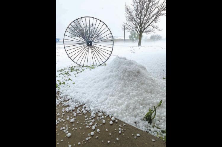 KINGFISHER STREETS and yards look snow-covered Monday evening after a hail storm battered much of the city. This picture was taken on West Meadow Lane on the southwest side of Kingfisher. [Photo provided by Gabriel Perez Jr.]