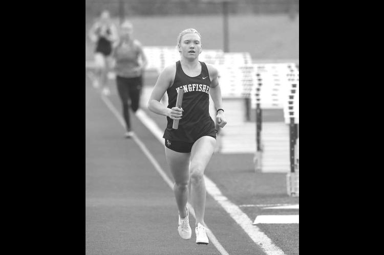 KINGFISHER’S Scout Snodgrass is pictured running her leg of the 3,200 meter relay during a meet at Thomas earlier this season. She ran the anchor leg of the winning two-mile relay team last Friday in Chisholm. [KT&amp;FP Staff Photo]