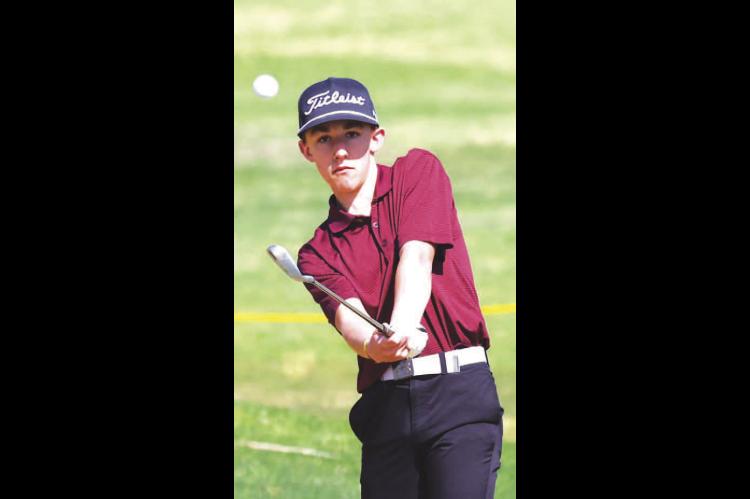 CASHION GOLFER Judd Graham intently watches his ball on the par-4 11th hole at Kingfisher Golf Course during Monday’s Dover Small School Boys Invitational. For Cashion’s results as well as three other county teams in the tournament, see Page 6 of this