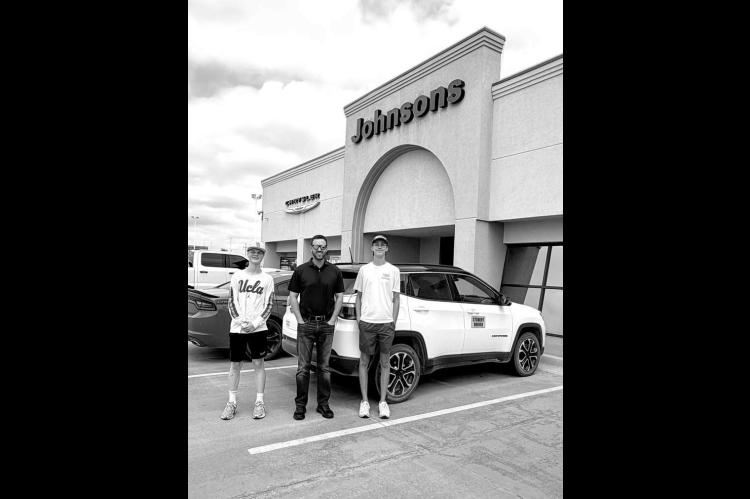 CAR LOAN – Driver’s education students in Kingfisher are wrapping up the driving portion of their course this summer. Helping make that possible every year is Johnsons of Kingfisher, which loans a vehicle to be used for the course. Jeff Johnson (center) is pictured with driver’s ed students Walker Sanders (left) and Hagen Owens in front of the vehicle that was loaned out this year. [Photo provided]