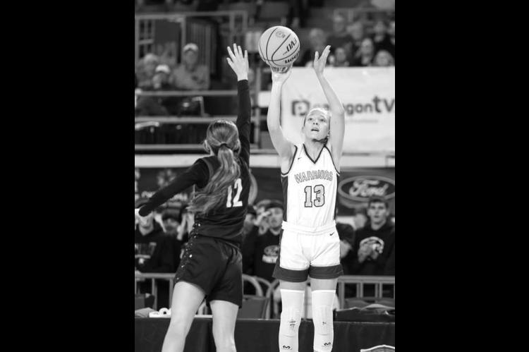 OKARCHE SOPHOMORE Katie Parham shoots a 3-pointer over Am-Po’s Brylee Keck during the Lady Warriors’ win Tuesday. [Photo by Russell Stitt/www.stitt.smugmug.com]